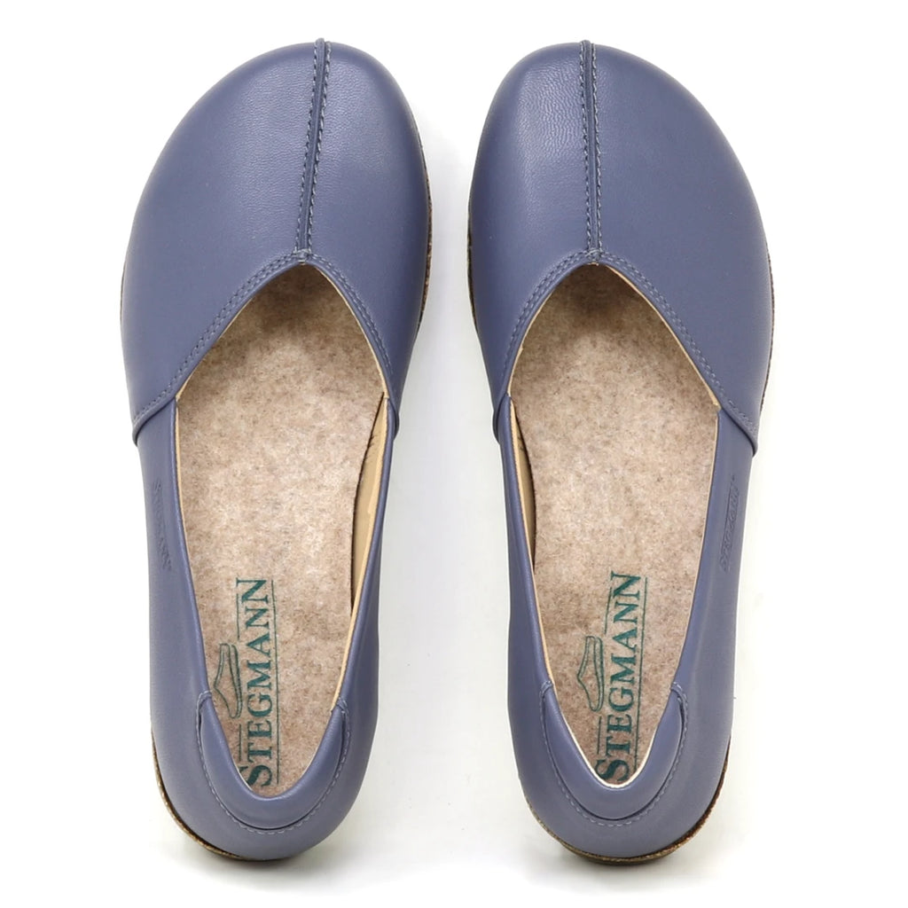 A pair of Women's Liesl Stretch Leather Skimmer flats in purple, made from buttery-soft leather with beige felt insoles. "Stegmann" is printed on the insoles and the shoes are shown from above.