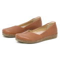 The Women's Liesl Stretch Leather Skimmer is a pair of buttery-soft brown slip-on flats with cork soles, a simple design, a small cut-out on the upper front, and a comfortable wide toe box.