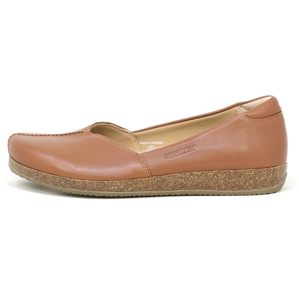 The Women's Liesl Stretch Leather Skimmer, shown from the side on a white background, is a brown flat featuring buttery-soft leather, a cork sole, and a wide toe box.