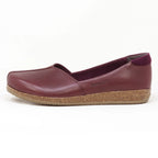 A single Women's Liesl Leather Skimmer in maroon, with a wide toe box and flat cork sole, made from leather and fabric, is displayed against a plain white background.