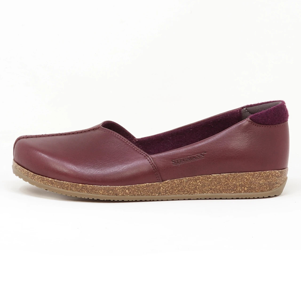 A single Women's Liesl Leather Skimmer in maroon, with a wide toe box and flat cork sole, made from leather and fabric, is displayed against a plain white background.