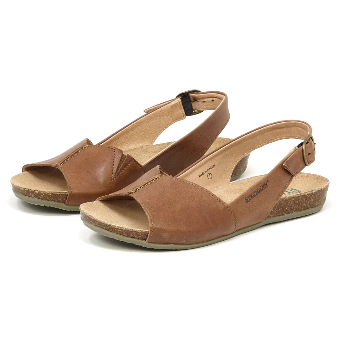 The Women's Louisa Leather Slingback Sandals feature brown leather with open toes, ankle straps, and cork soles, complemented by a cushioned footbed for extra comfort.