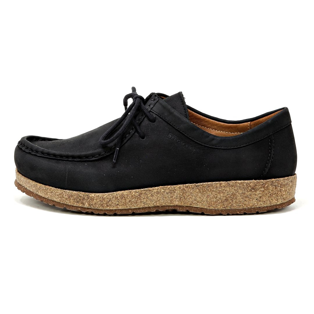 Women's Mainz Leather Moc Shoe in black, featuring an oiled leather upper, cork sole, and black laces. Side view shown.