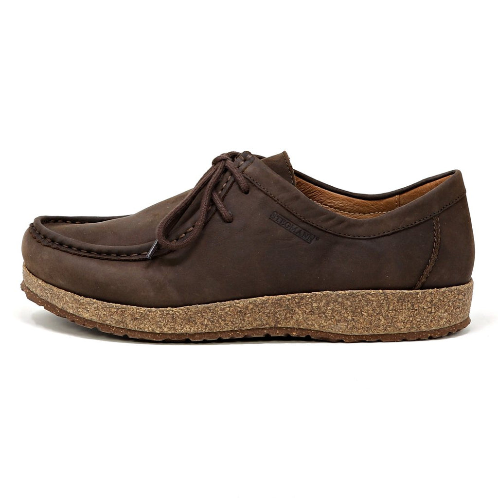 The Women's Mainz Leather Moc Shoe showcases a brown moc stitch design with an oiled leather upper and textured brown sole, side view. Its UltraComfort footbed ensures all-day wear.