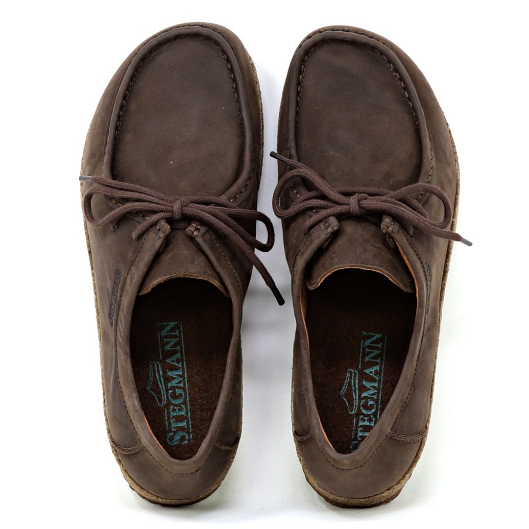 The Women's Mainz Leather Moc Shoe, in brown, features laces and moc stitching. With rounded toes and seam details on an oiled leather upper, it showcases a visible logo inside. Experience all-day comfort with the luxurious UltraComfort footbed. Viewed from above.