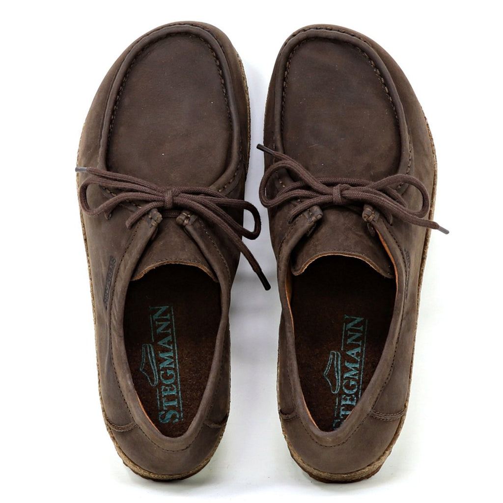 The Women's Mainz Leather Moc Shoe, in brown, features laces and moc stitching. With rounded toes and seam details on an oiled leather upper, it showcases a visible logo inside. Experience all-day comfort with the luxurious UltraComfort footbed. Viewed from above.