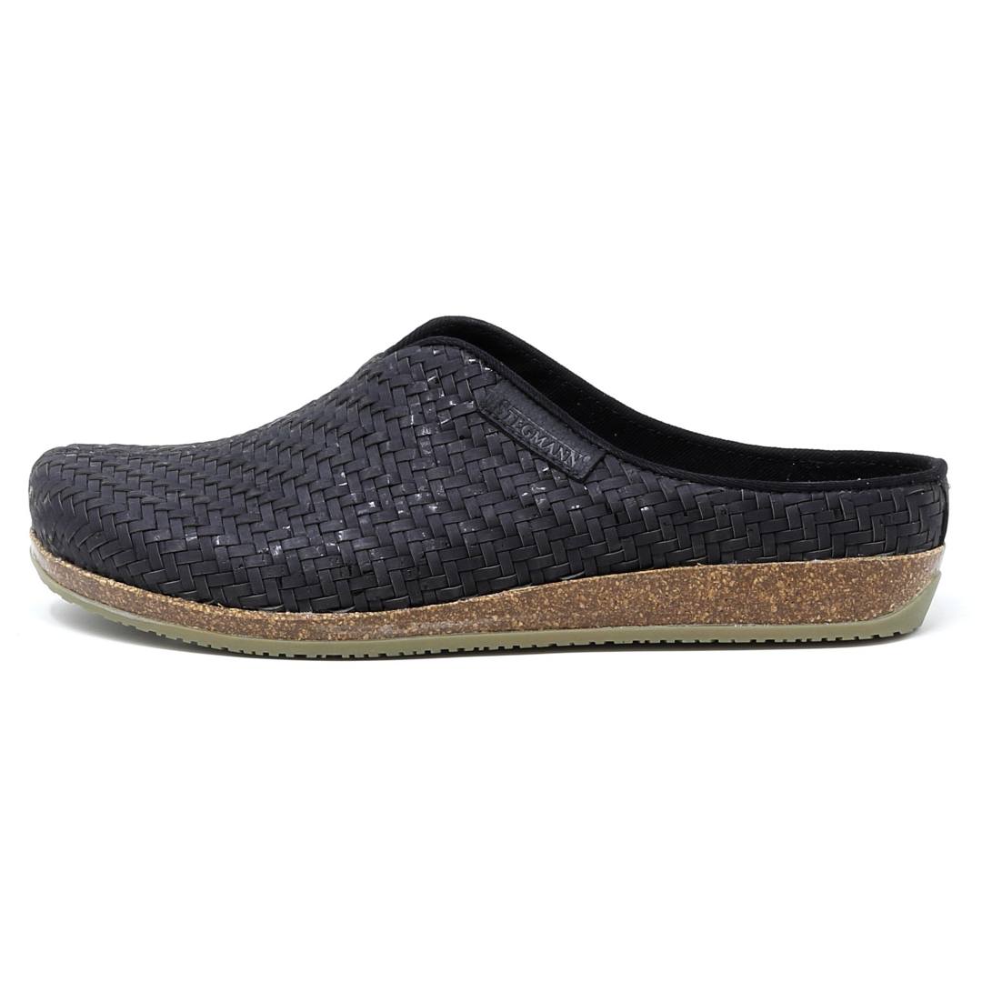 The Women's Maria Woven Cork Mule in black showcases a sustainable cork sole with excellent arch support, beautifully highlighted from the side view.