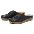 Women's Maria Leather Mule in black leather, featuring slip-on style, cork soles, and a wide toe box, displayed side by side on a white background.
