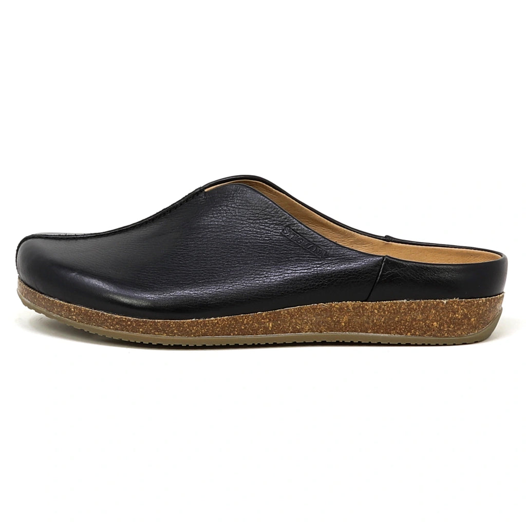 A side view of the Women's Maria Leather Mule, a black slip-on clog with a cork sole, wide toe box, and low heel, photographed against a white background.