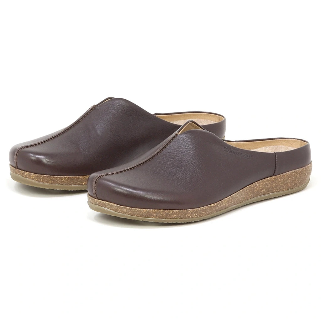 The Women's Maria Leather Mule features brown leather, cork soles, a wide toe box, and slip-on design, displayed against a white background.
