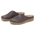 The Women's Maria Leather Mule features brown leather, cork soles, a wide toe box, and slip-on design, displayed against a white background.