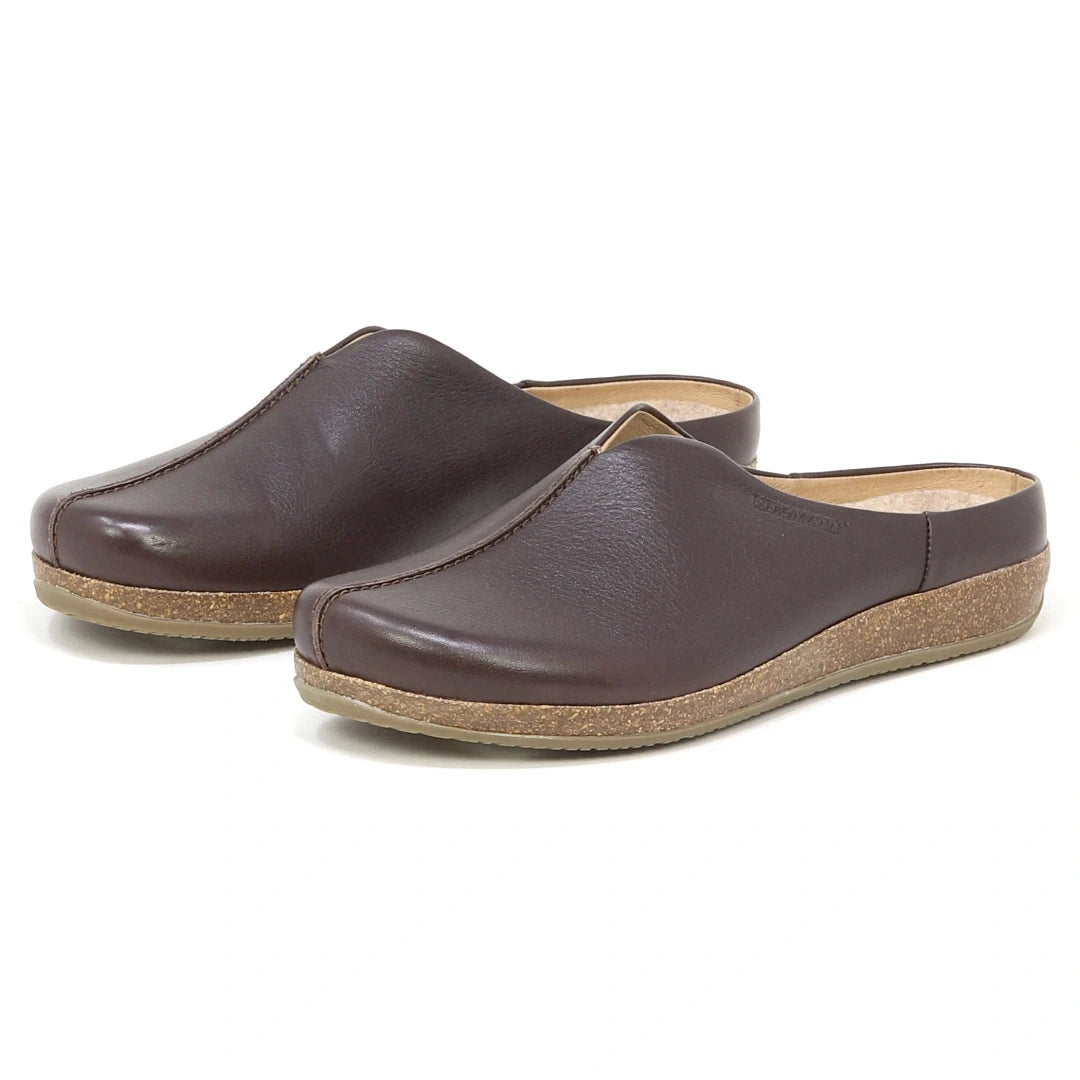 The Women's Maria Leather Mule features brown leather, cork soles, a wide toe box, and slip-on design, displayed against a white background.