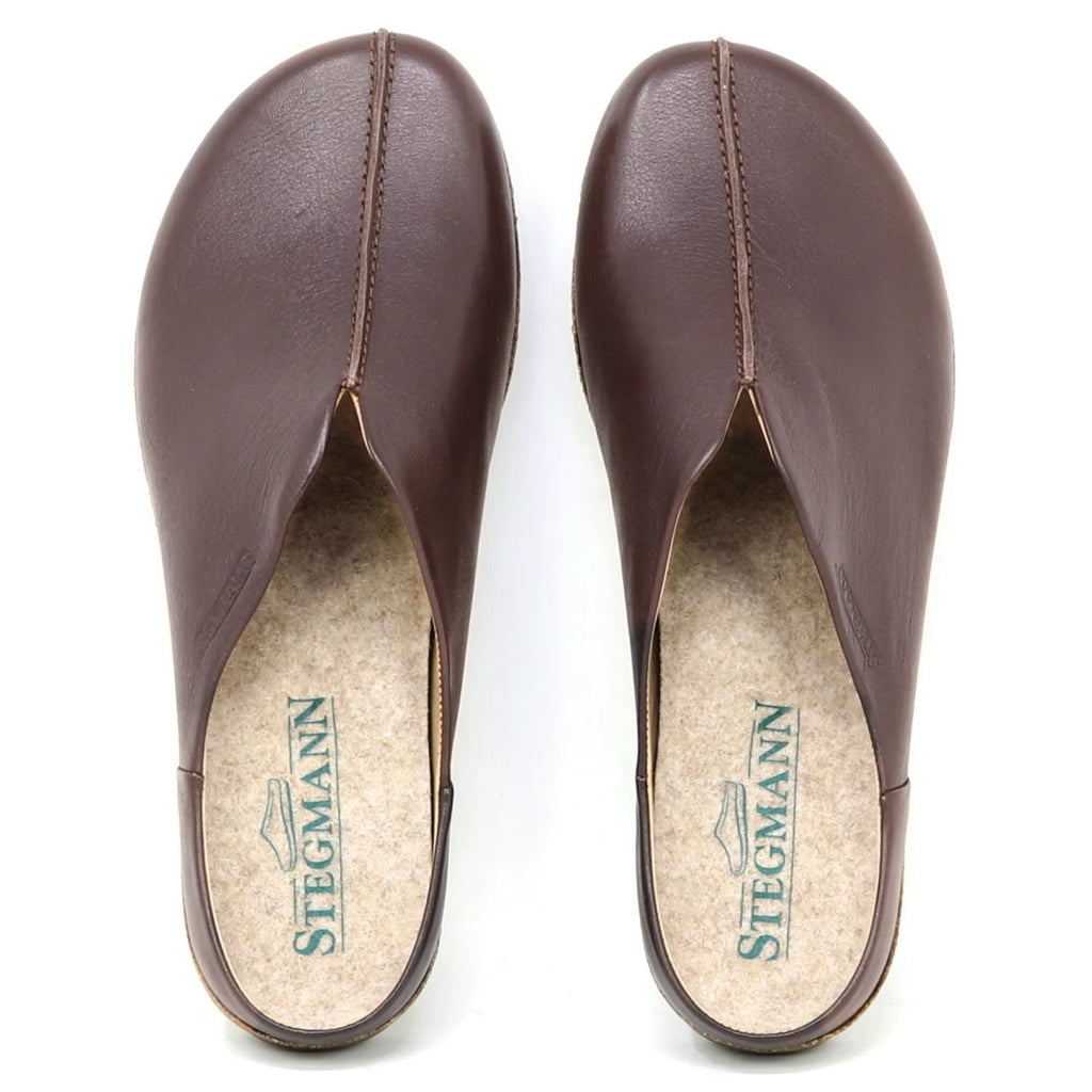 A pair of Women's Maria Leather Mule slip-on clogs in brown leather, seen from above. They feature a wide toe box, cork insoles branded "STEGMANN" with a shoe logo.