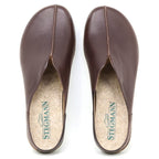 A pair of Women's Maria Leather Mule slip-on clogs in brown leather, seen from above. They feature a wide toe box, cork insoles branded "STEGMANN" with a shoe logo.