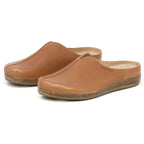 The Women's Maria Leather Mule features brown leather, slip-on style, cork soles, and a wide toe box, shown on a white background.