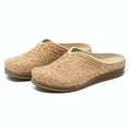 The Women's Maria Woven Cork Mule features a pair of slip-on clogs with brown soles, showcasing sustainable cork footbeds for enhanced arch support, viewed from the side.