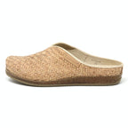 The Women's Maria Woven Cork Mule is a tan slipper with a sustainable cork sole and arch support. Featuring a closed toe and open heel, this stylish shoe is showcased from the side against a plain white background.