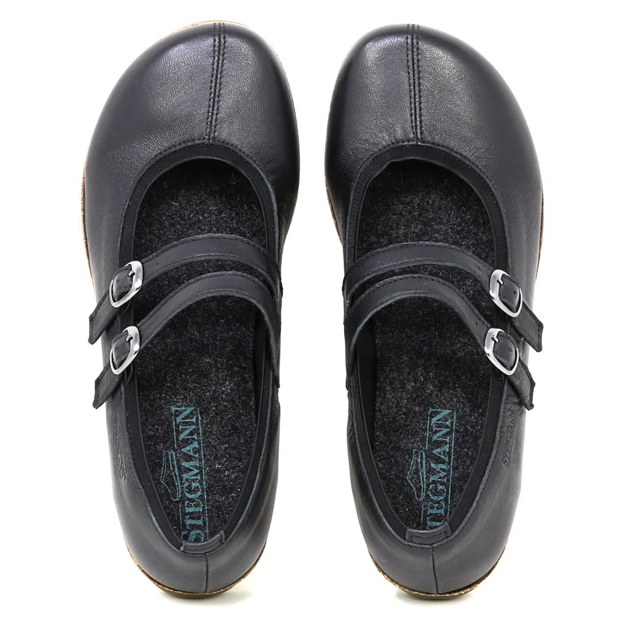 The Women's Marielle Stretch Leather Mary-Jane features black stretch leather, two buckle straps, and arch support, shown from above on a white background.
