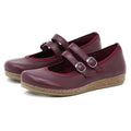 Women's Marielle Stretch Leather Mary-Jane shoes in burgundy, featuring two buckle straps and cork soles, crafted from stretch leather for a comfortable fit and enhanced arch support, displayed against a white background.