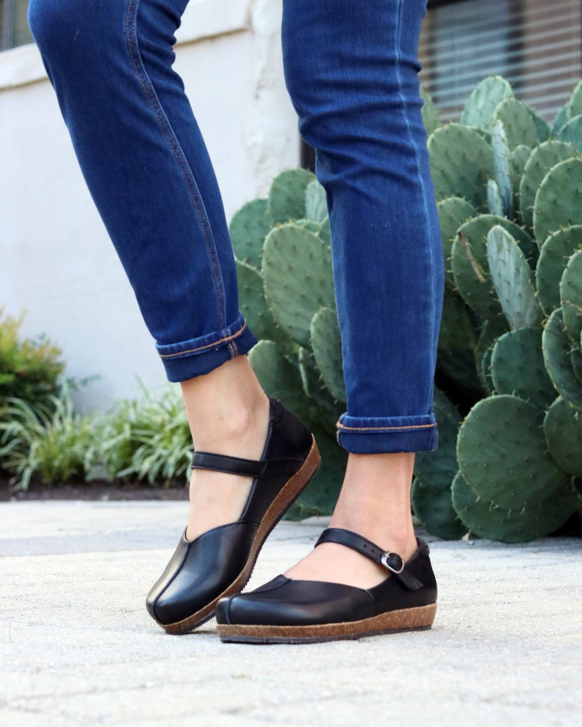 The 'Eva' Mary-Jane in Black. This shoe is cute, comfortable and offers incredible arch support. Lined with soft felt it can be worn barefoot or with socks. Removable insole. Loved by teachers, doctors and women who spend all day on their feet!