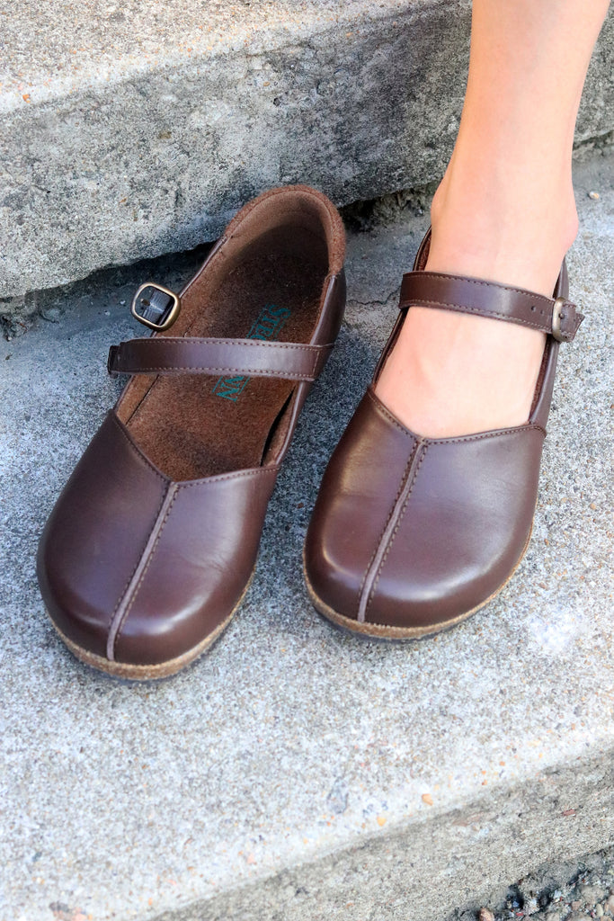 The 'Eva' Mary-Jane in Brown. This shoe is cute, comfortable and offers incredible arch support. Lined with soft felt it can be worn barefoot or with socks. Removable insole. Loved by teachers, doctors and women who spend all day on their feet!
