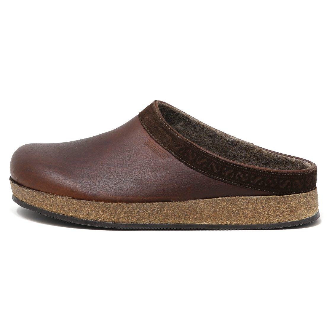 The Men's Graz Leather Clog features a brown vegetable-tanned leather slip-on design with a cork footbed for comfort and decorative trim on the upper edge, enhanced by a wool felt-lined interior for luxurious warmth and softness.