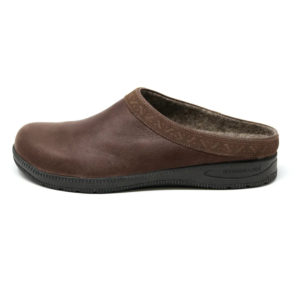 The Men's Graz Leather Clog with Sport Sole is made from brown vegetable tanned leather and features a recycled rubber sole, shown in side profile.