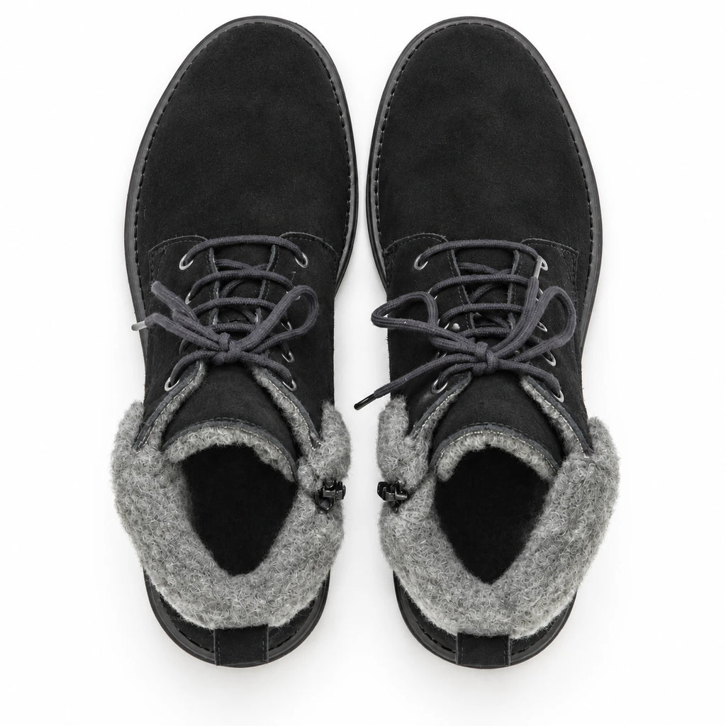 A pair of Women’s Merano Chukka Boots in black waterproof suede with gray fleece lining, styled as classic winter chukka boots, shown from above against a white background.