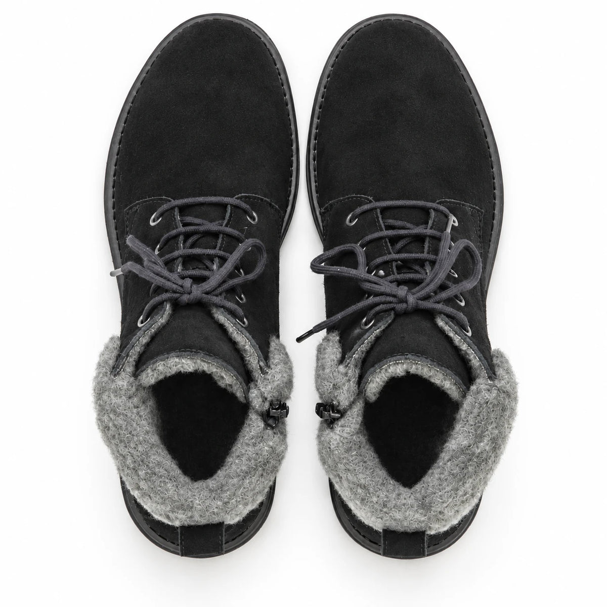 A pair of Women’s Merano Chukka Boots in black waterproof suede with gray fleece lining, styled as classic winter chukka boots, shown from above against a white background.