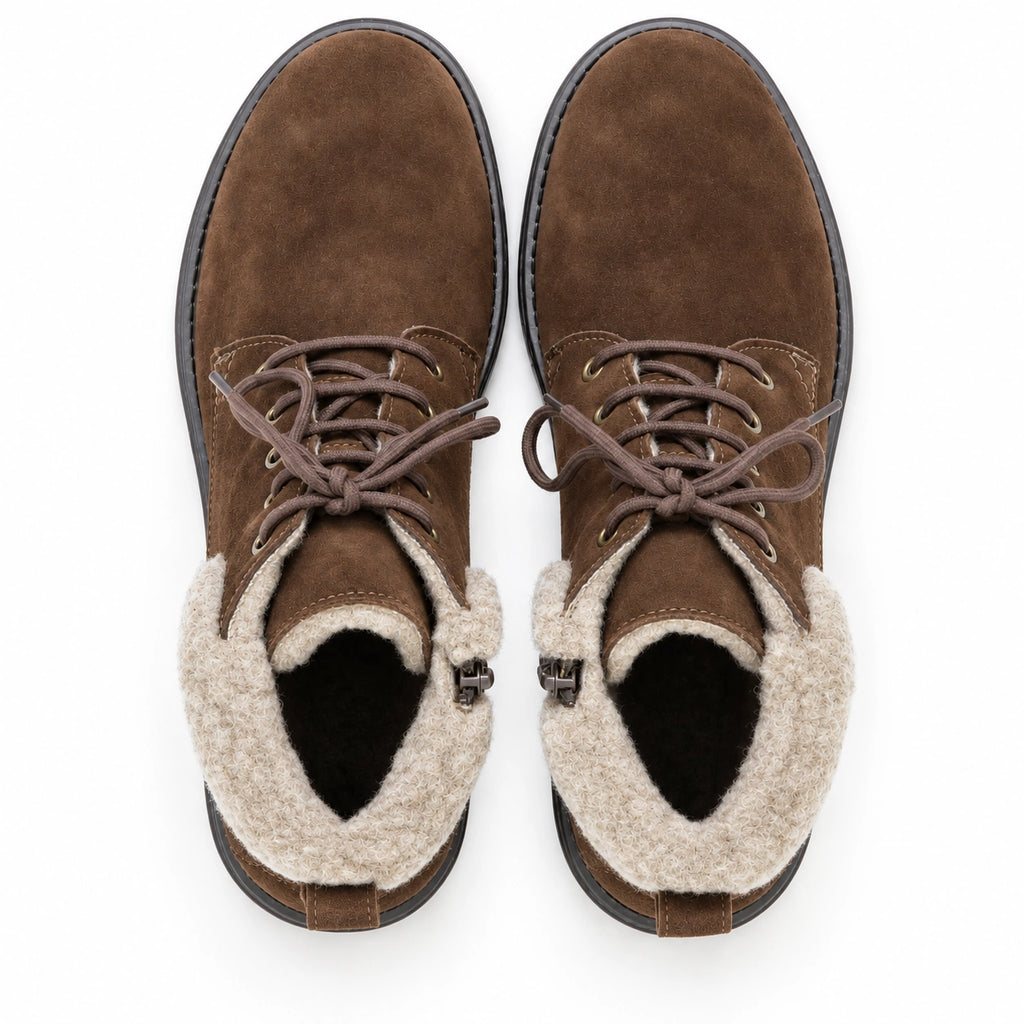 A pair of Women’s Merano Chukka Boots in brown suede with light beige fleece lining, viewed from above on a white background.