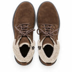 A pair of Women’s Merano Chukka Boots in brown suede with light beige fleece lining, viewed from above on a white background.