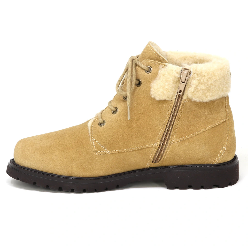Women’s Merano Chukka Boot in tan with a side zipper, wool shearling-lined collar, and a dark lug sole.