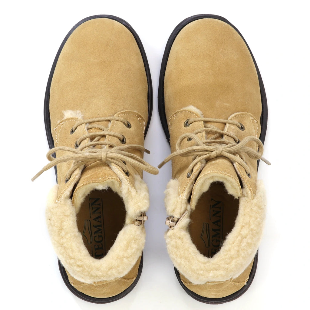 Top-down view of Women’s Merano Chukka Boot in tan suede with faux-fur lining and laces, styled as lightweight winter boots.