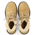Top-down view of Women’s Merano Chukka Boot in tan suede with faux-fur lining and laces, styled as lightweight winter boots.