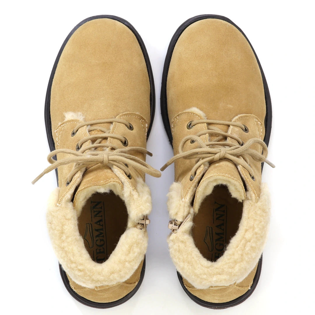 Top-down view of Women’s Merano Chukka Boot in tan suede with faux-fur lining and laces, styled as lightweight winter boots.