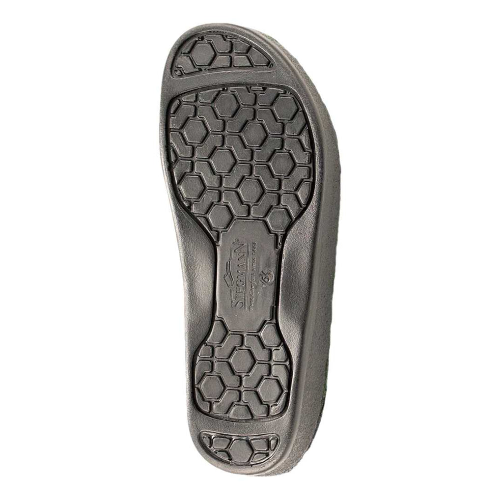 Black shoe sole with hexagonal tread and Siekmann logo at center, designed for cushioning and support in the Women’s WoolFlex Wool Clog – Medium, a podiatrist-recommended choice.