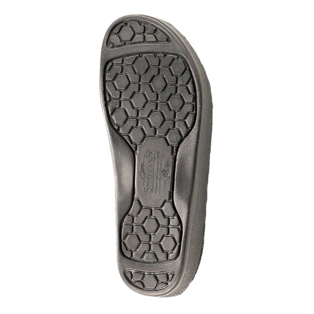 Black shoe sole with hexagonal tread and Siekmann logo at center, designed for cushioning and support in the Women’s WoolFlex Wool Clog – Medium, a podiatrist-recommended choice.