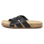 The Women's Romy Slide Sandal features black leather with two wide crisscross straps and a contoured cork footbed for comfort, shown from the side.