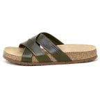 The Women's Romy Slide Sandal in green leather features criss-cross straps and a contoured cork footbed for comfort, shown from the side.