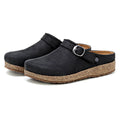 Viewed from the side, the Women's Tirol Leather Clog is a pair of black clogs made from oiled leather with an adjustable buckle strap and cork-like soles.