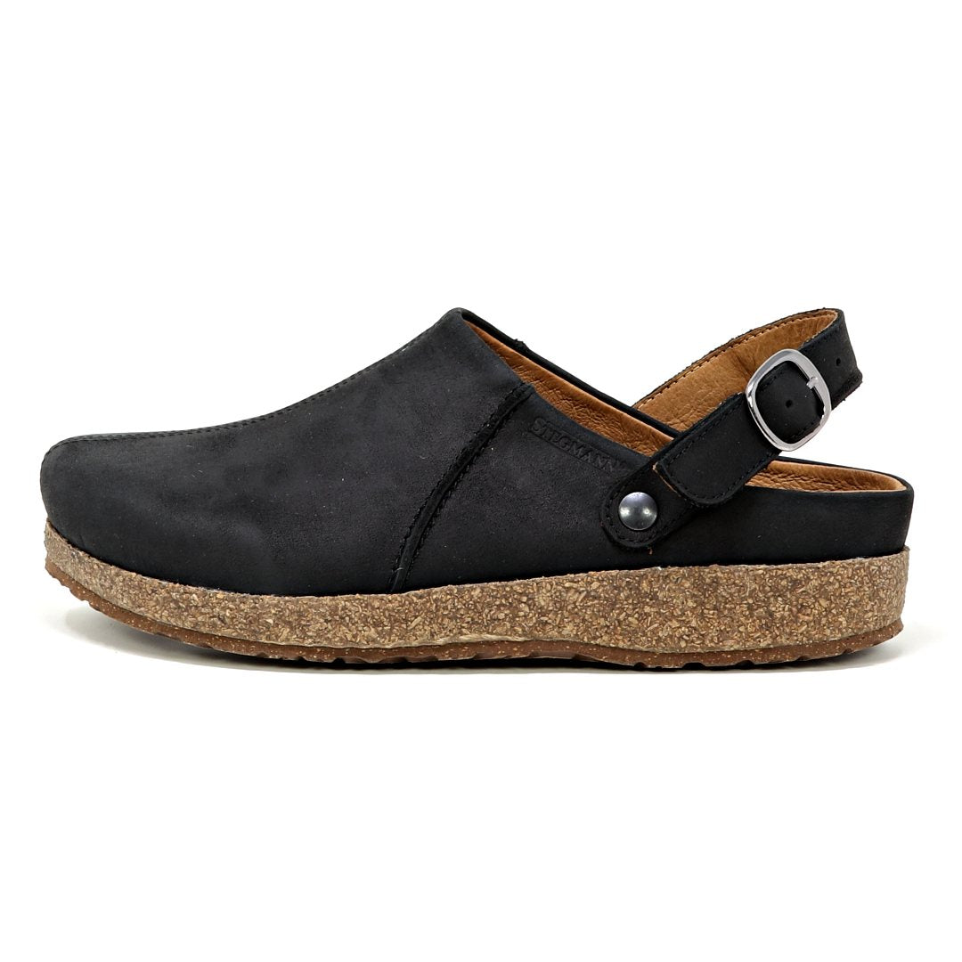 Women's Tirol Leather Clog in black leather showcases a wide toe box and cork sole, with an adjustable back strap for comfort, side view.