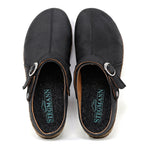 The Women's Tirol Leather Clog features black slip-on clogs with adjustable straps, cork soles, and oiled leather. A wide toe box is complemented by the Stegmann logo on the insole.