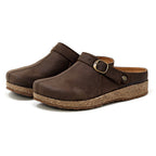 A pair of Women's Tirol Leather Clogs in brown oiled leather, featuring adjustable straps and cork soles, viewed from an angle.