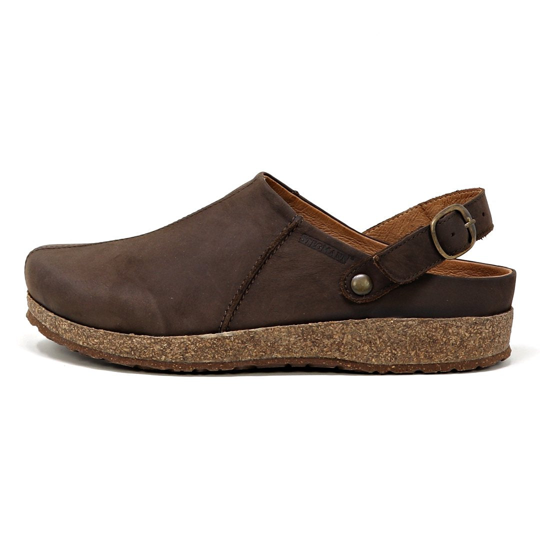 Women's Tirol Leather Clog in brown leather with a wide toe box, cork sole, and adjustable strap, viewed from the side.