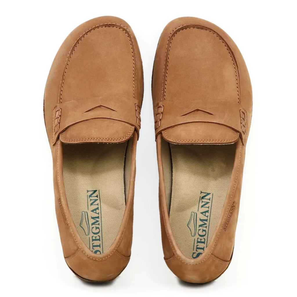 Aerial view of brown Women's Victoria nubuck loafers by Stegmann, featuring stitching details and arch support, on a white background.