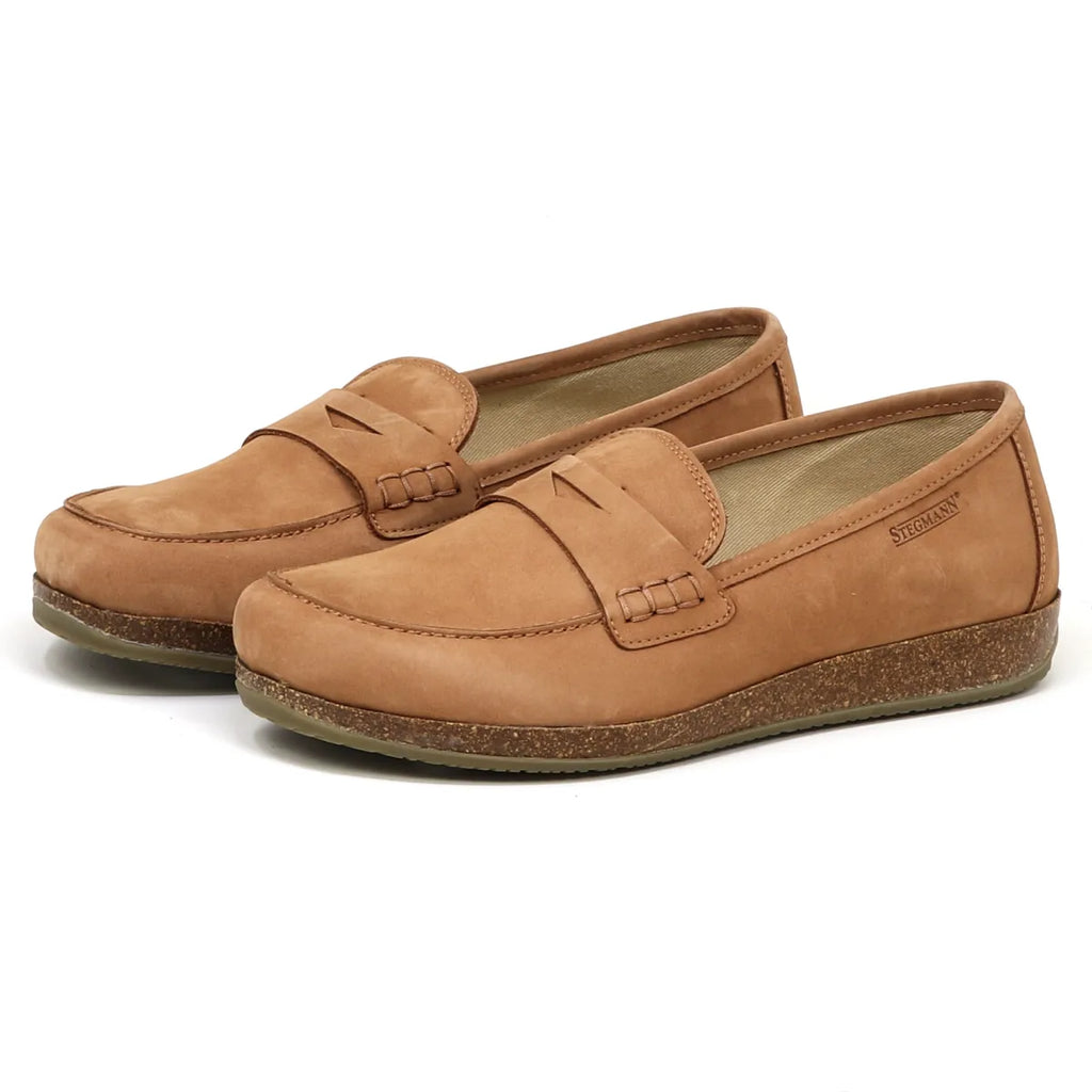 The Women's Victoria Loafer in tan leather features a shock-absorbing midsole, textured sole, and stitch detailing in an angled view.