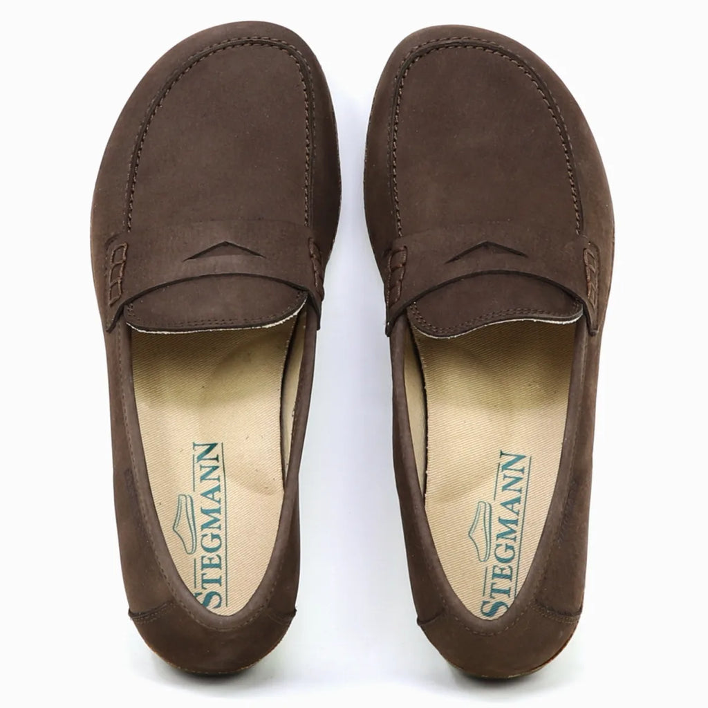 A pair of brown suede Women's Victoria Loafers with stitching details, a branded "Stegmann" insole, and arch support for all-day comfort.