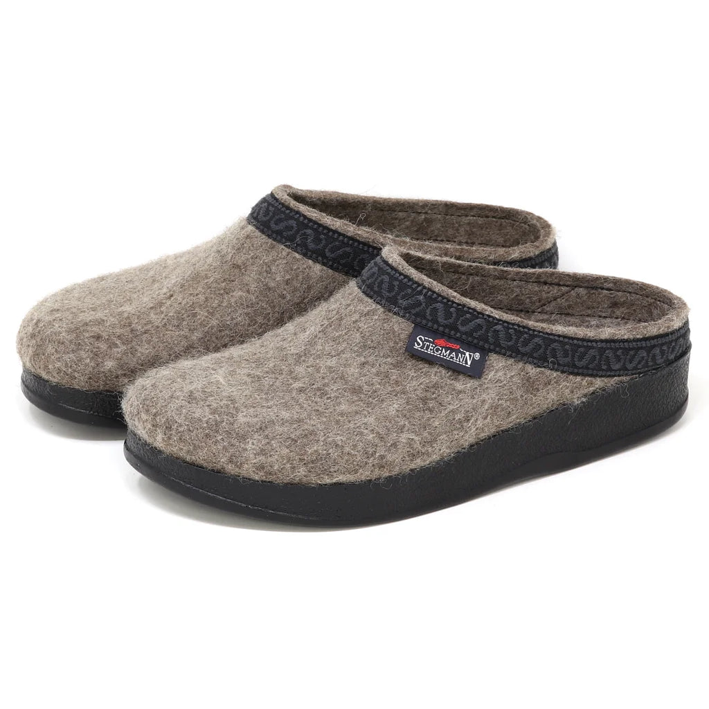 Women’s WoolFlex Wool Clog - Medium: a pair of gray Merino wool clogs with black trim and a black sole, designed as a supportive house shoe.