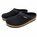 The Men's Original 108 Wool Clog is a pair of black slip-on clogs made from Merino wool, featuring cork soles and a patterned trim, designed as a stylish men's shoe with a supportive sole for comfort.