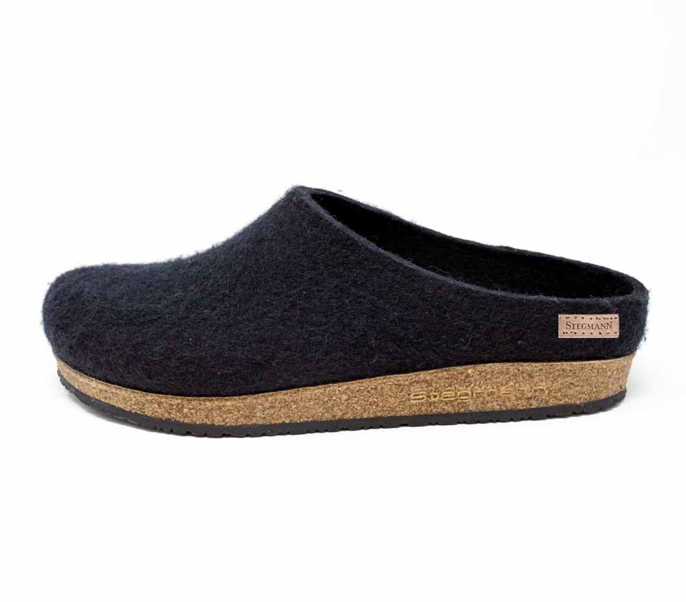 The Women's Essenz Wool Clog, featuring a cozy design and a cork sole, is made from soft Merino wool and presented in a stylish side view.